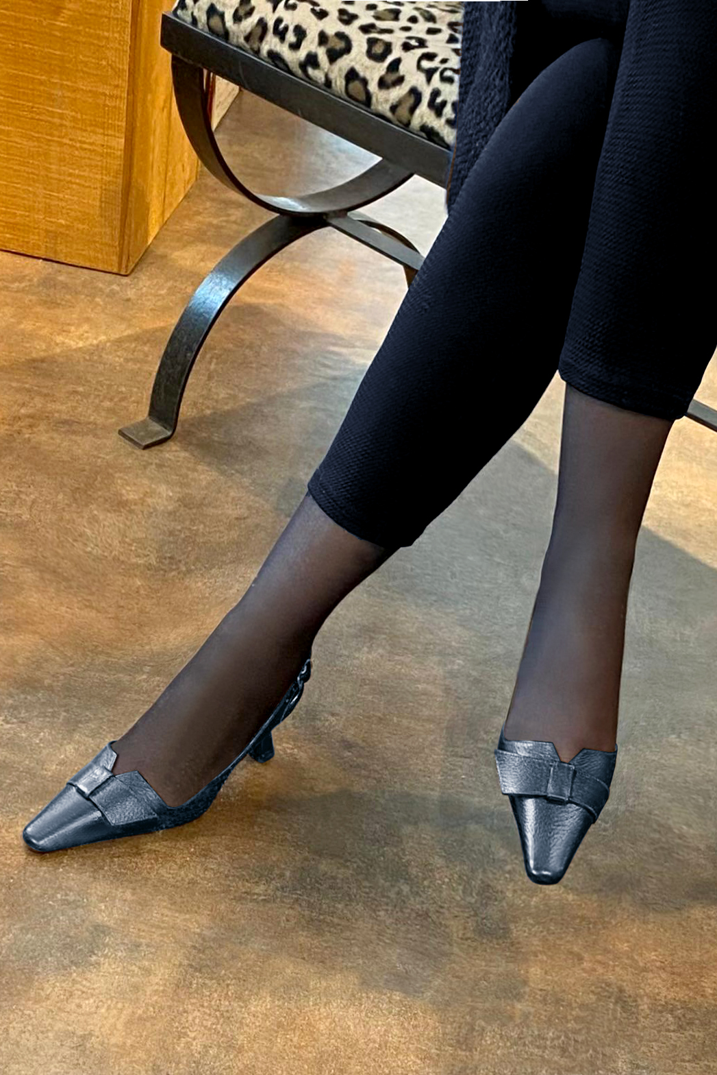 Denim blue women's slingback shoes. Tapered toe. Medium spool heels. Worn view - Florence KOOIJMAN